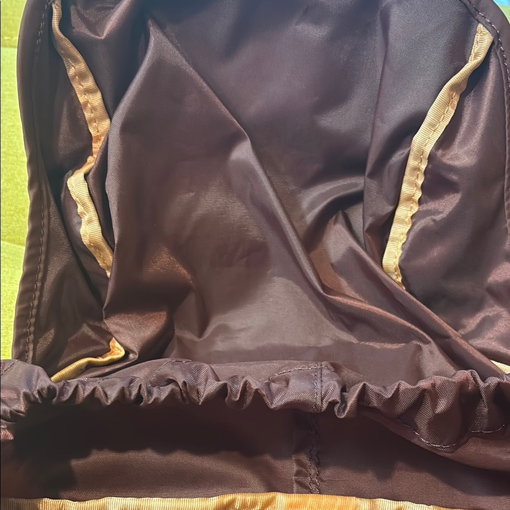 Stylish large Athleta Burgundy Backpack with zippers and padded back. - Picture 4 of 5